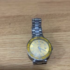 FOSSIL WATCH WITH YELLOW FACE AND SILVER ADJUSTABLE BAND